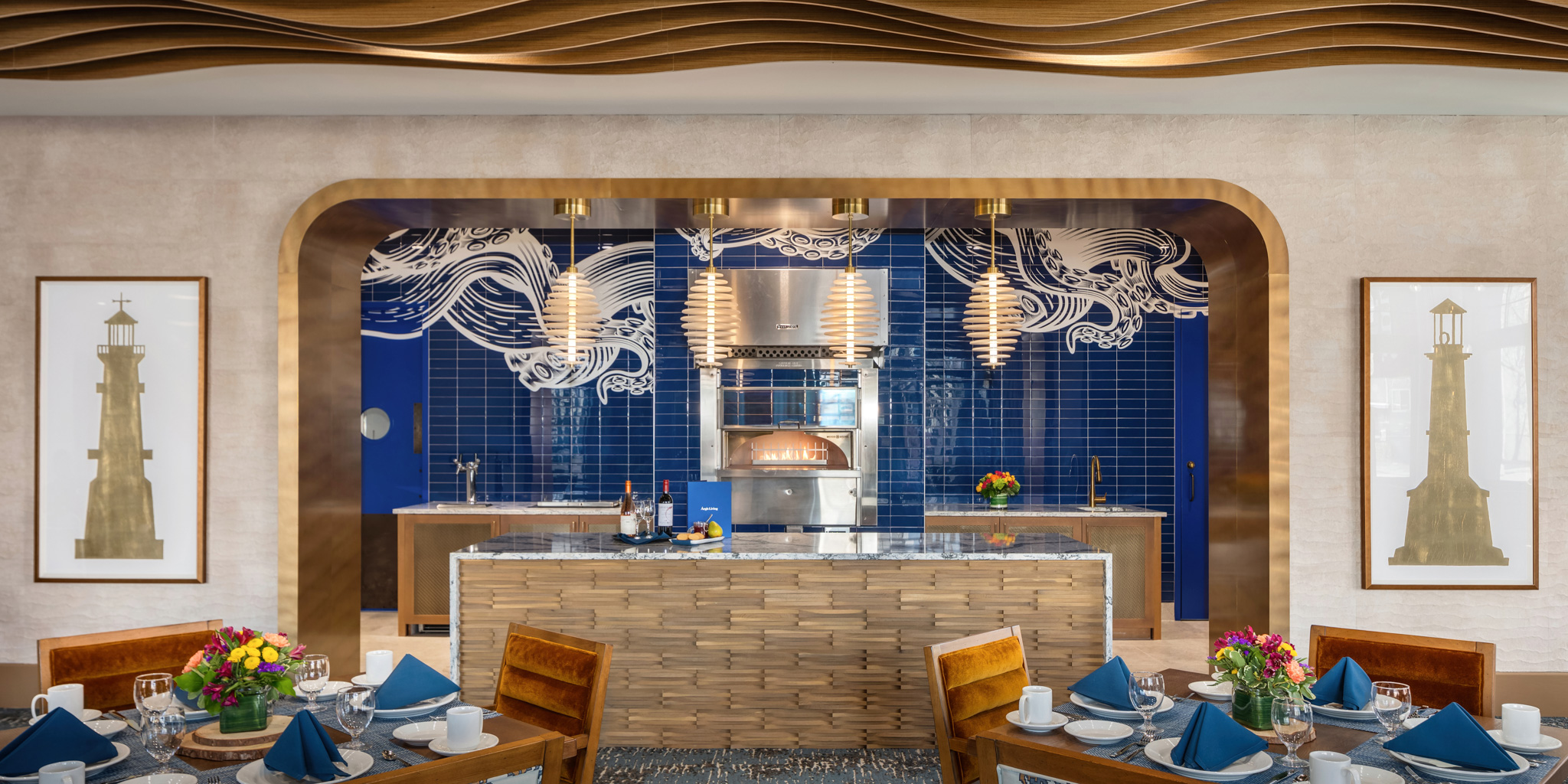 Modern kitchen and dining area featuring elegant design elements, including a striking blue backsplash with artistic patterns, warm wood accents, and stylish pendant lighting. Ideal for entertaining in the vibrant Pacific Northwest.