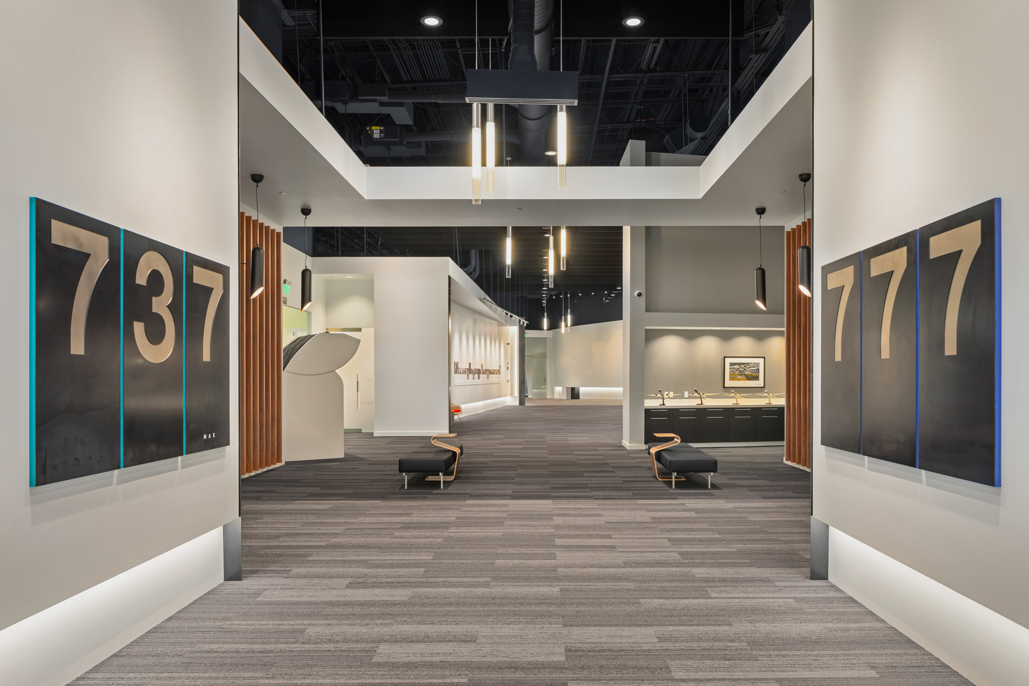 Modern office hallway featuring stylish signage and contemporary lighting, designed for a sleek corporate environment in Seattle.