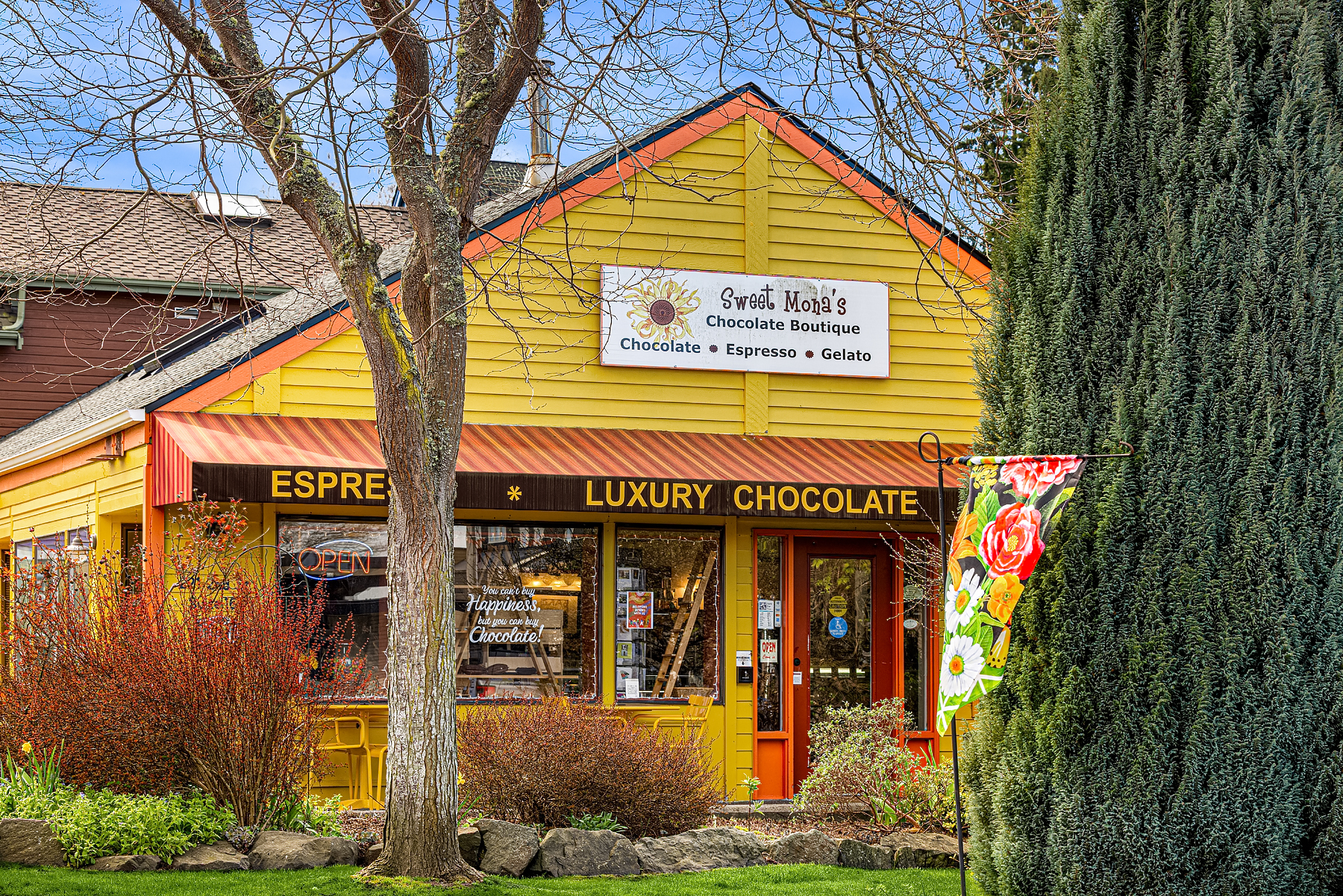 Charming chocolate boutique exterior featuring a bright yellow facade and inviting signage, located in the Pacific Northwest.